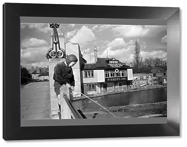 A young boy fishing in the Grand Union canal at Boxmoor, Hertfordshire. Circa 1945
