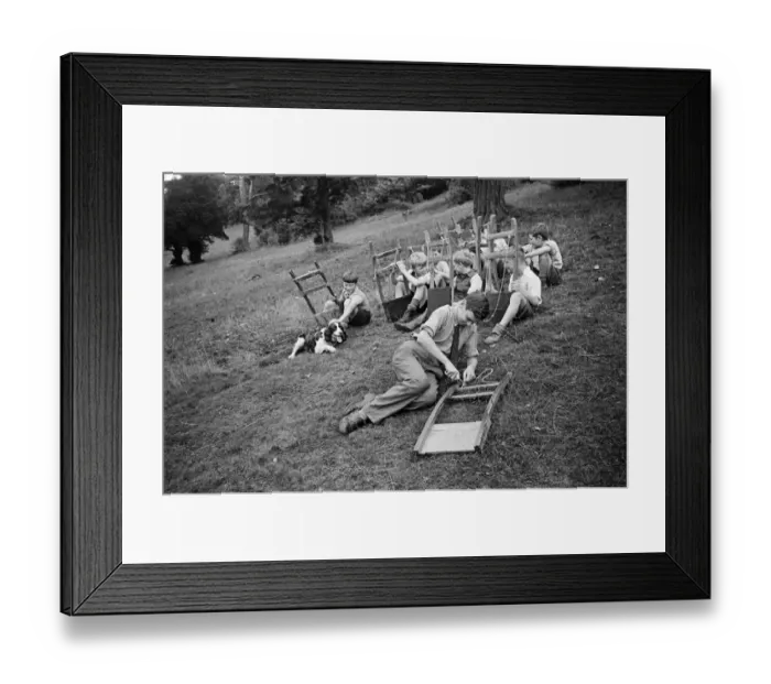 Framed Print : Schoolboys from West Wycombe go tobogganing on a hill in the village. circa 1945