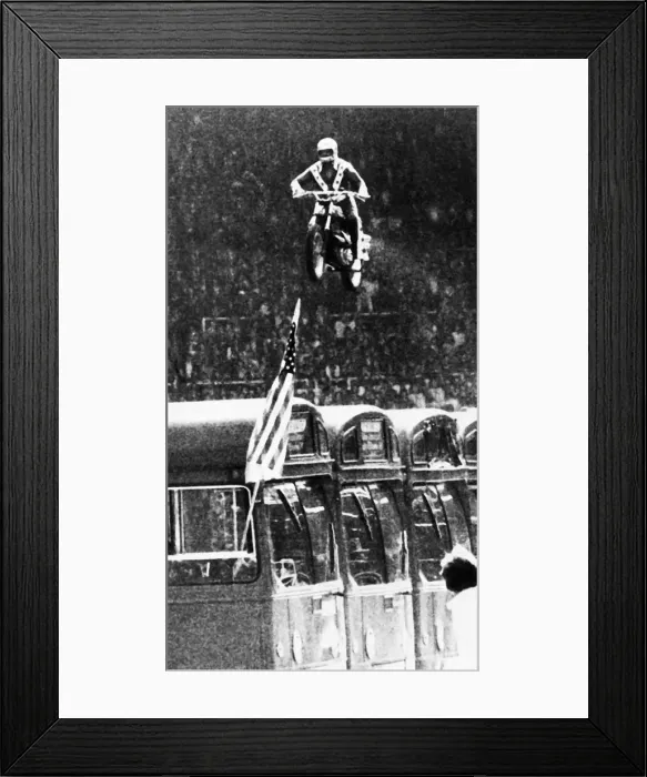 Framed Print : Evel Knievel American motorcycle stuntman daredevil 1975 leaping over buses