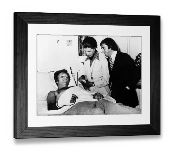 Framed Print : Evel Knievel American stuntman daredevil in hospital 1975 visited by Scottish Framed Print : Evel Knievel American stuntman daredevil in hospital 1975 visited by Scottish