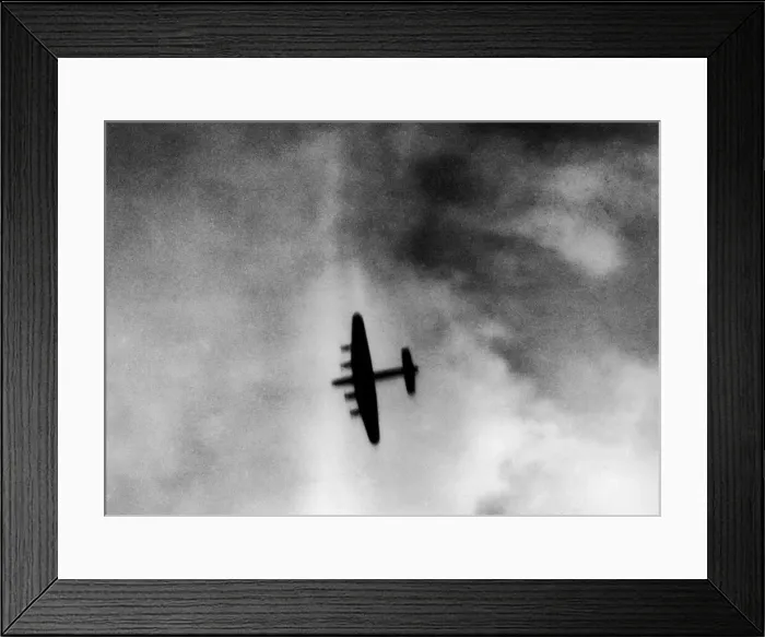 Framed Print : One of the attacking four engined Avro Lancaster bombers over the target area during Framed Print : One of the attacking four engined Avro Lancaster bombers over the target area during