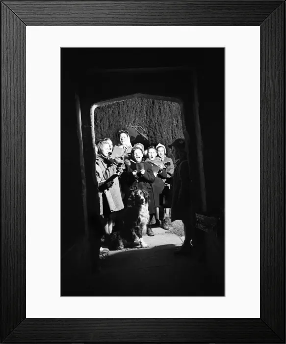 Framed Print : Adults and children carol singing at night time outside Sulgrave Manor, Northamptonshire Framed Print : Adults and children carol singing at night time outside Sulgrave Manor, Northamptonshire