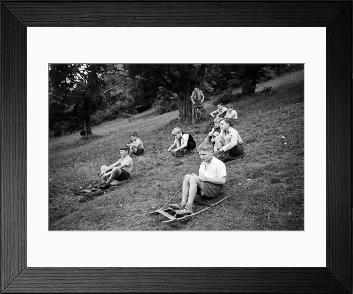 Framed Print : Schoolboys from West Wycombe go tobogganing on a hill in the village. circa 1945 Framed Print : Schoolboys from West Wycombe go tobogganing on a hill in the village. circa 1945