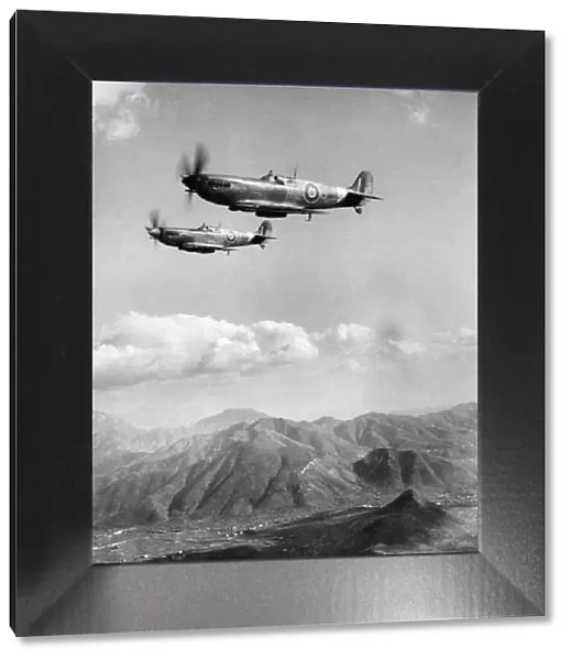 Spitfire fighter planes of the RAF keeping a dawn to dusk patrol over the mountainous