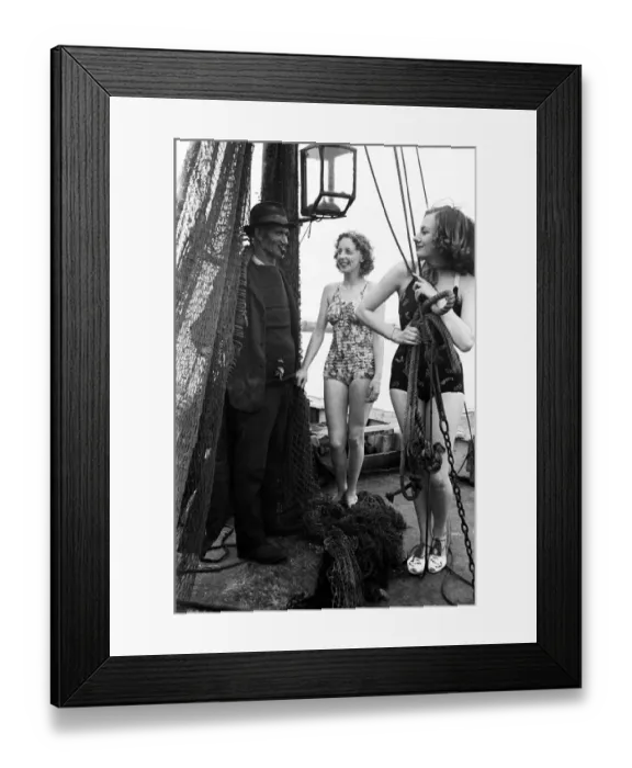 Framed Print : Women in their bathing costumes with a fisherman, along the coast, Hastings, circa 1945