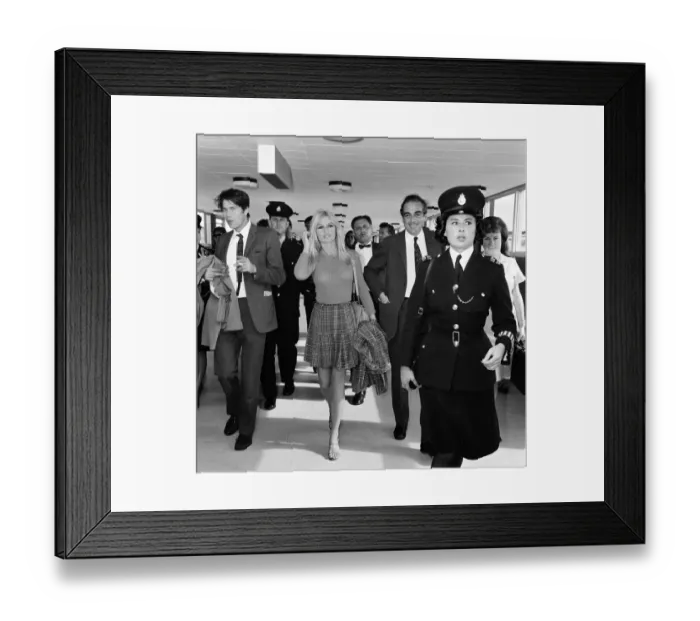 Framed Print : French actress Brigitte Bardot arrives at London airport as she visits England to film