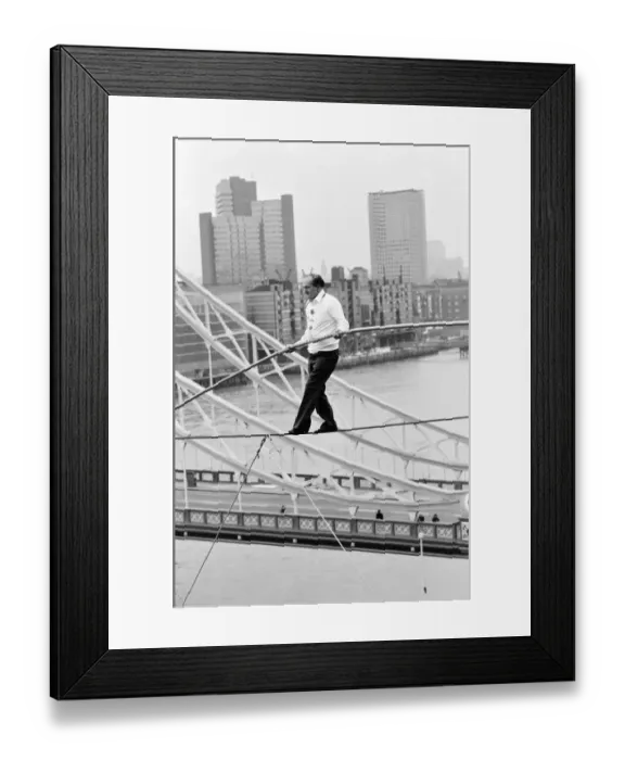Framed Print : Karl Wallenda, Tightrope Walker, crosses 100ft above the ground, near Tower Bridge Framed Print : Karl Wallenda, Tightrope Walker, crosses 100ft above the ground, near Tower Bridge