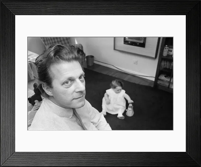 Framed Print : Raymond Cusick designer of the Daleks from Doctor Who 1965 playing with his Framed Print : Raymond Cusick designer of the Daleks from Doctor Who 1965 playing with his
