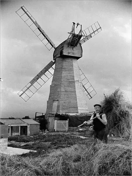 A man working near White Mill in Headcorn, Kent. The mill was Demolished in 1952