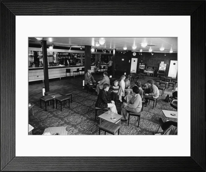 Framed Print : Passengers waiting for their flight to be called seen here at the bar at Teesside Airport