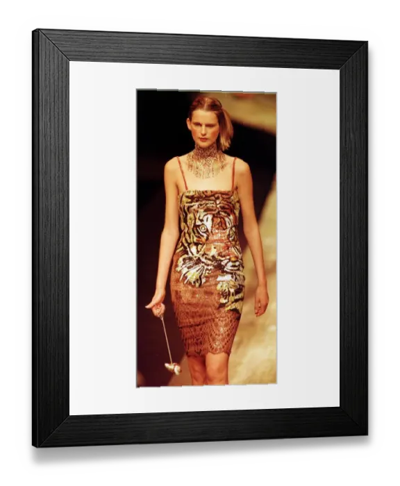 Framed Print : Stella Tennant models dress with tiger motif designed by Valentino at Paris Fashion Week Framed Print : Stella Tennant models dress with tiger motif designed by Valentino at Paris Fashion Week