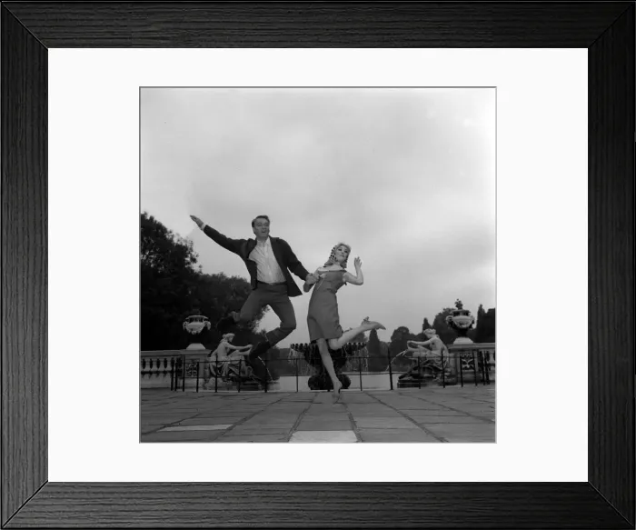 Framed Print : Frank Ifield singer with actress Annette Andre June 1965 jumping in the air hand Framed Print : Frank Ifield singer with actress Annette Andre June 1965 jumping in the air hand
