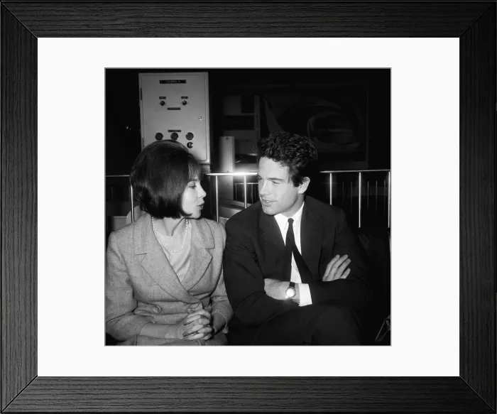 Framed Print : Warren Beatty actor meets actress Leslie Caron at London Airport
