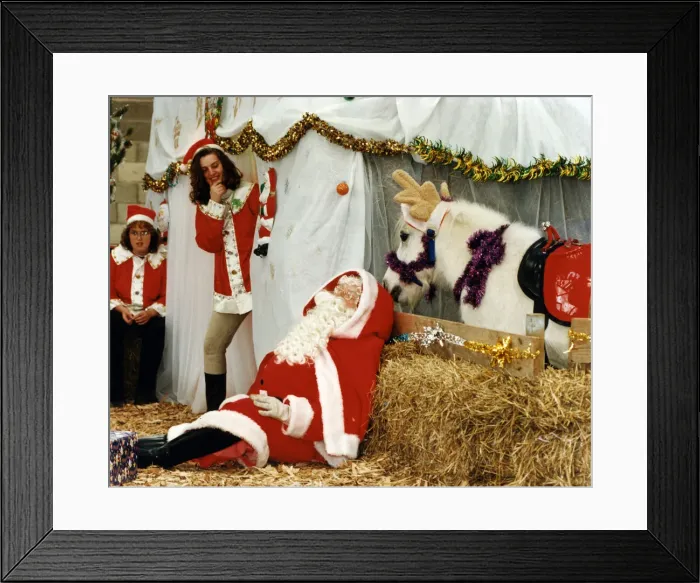Framed Print : Father Christmas sneeks a quick forty winks between visitors to his grotto Framed Print : Father Christmas sneeks a quick forty winks between visitors to his grotto