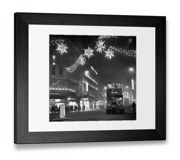 Framed Print : Christmas lights of shimmering stars hang over Lord Street near the corner of Whitechapel