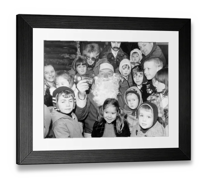 Framed Print : Father Christmas in John Walker Square listening to the wishes of all the little children