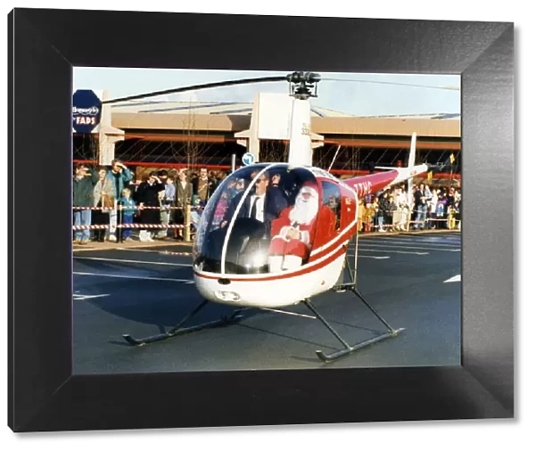Father Christmas arriving in style, in a helicopter at the car park of Homestyle by FADS