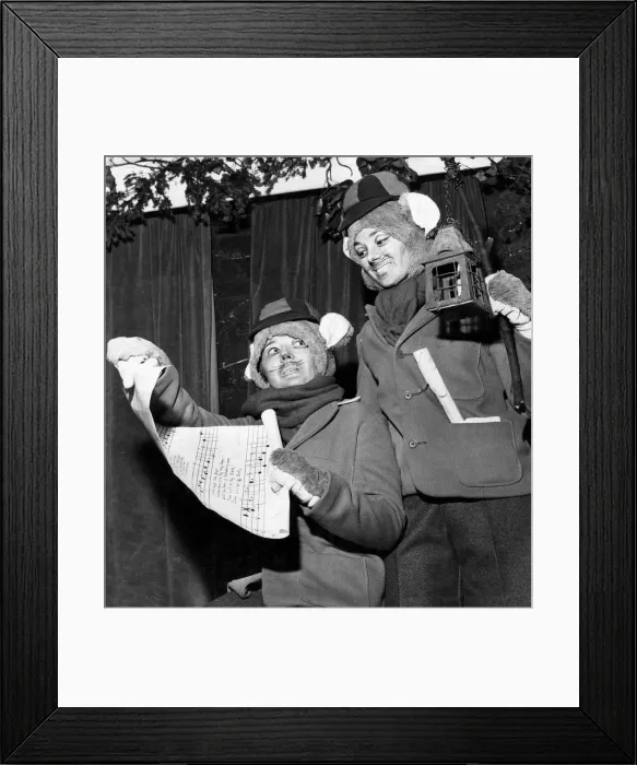 Framed Print : Two carol singing field mice (Rosslyn Main and Una Trimming) in a scene from Framed Print : Two carol singing field mice (Rosslyn Main and Una Trimming) in a scene from