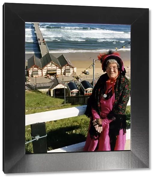 A lady poses by Saltburn Pier in Victorian clothing. 18th August 1991