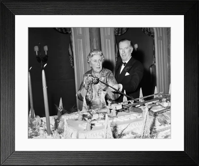 Framed Print : Agatha Christie cuts cake with sword 1962 at 10th anniversary of the play Mousetrap Framed Print : Agatha Christie cuts cake with sword 1962 at 10th anniversary of the play Mousetrap
