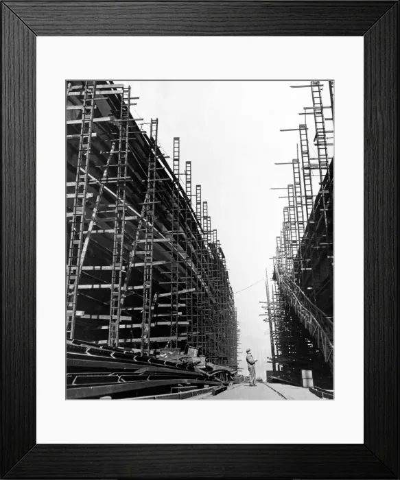Framed Print : A foreman checks area under construction and area completed on new liners being