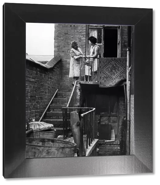 Slum housing in Birmingham. Mrs B Roach and daughter Ann Roach of Gladstone Road