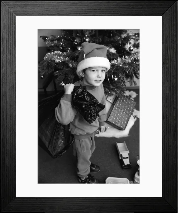 Framed Print : Daniel Bell came into the office with a sack of toys for the Examiner Christmas Toy Framed Print : Daniel Bell came into the office with a sack of toys for the Examiner Christmas Toy