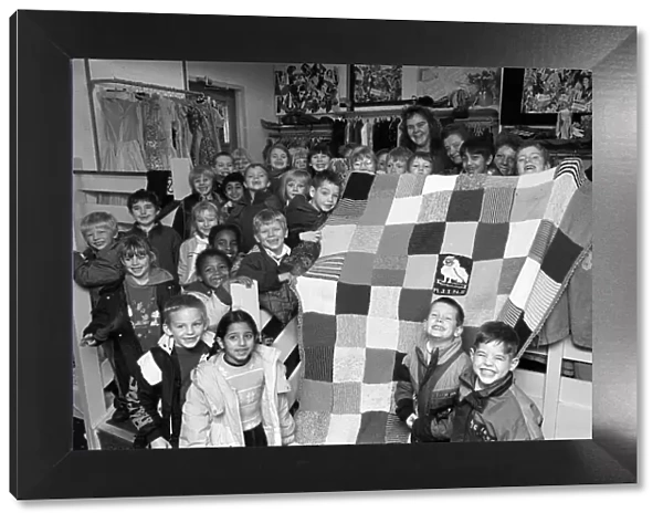 Moldgreen Junior and Infants School pulls with their knitted blanket