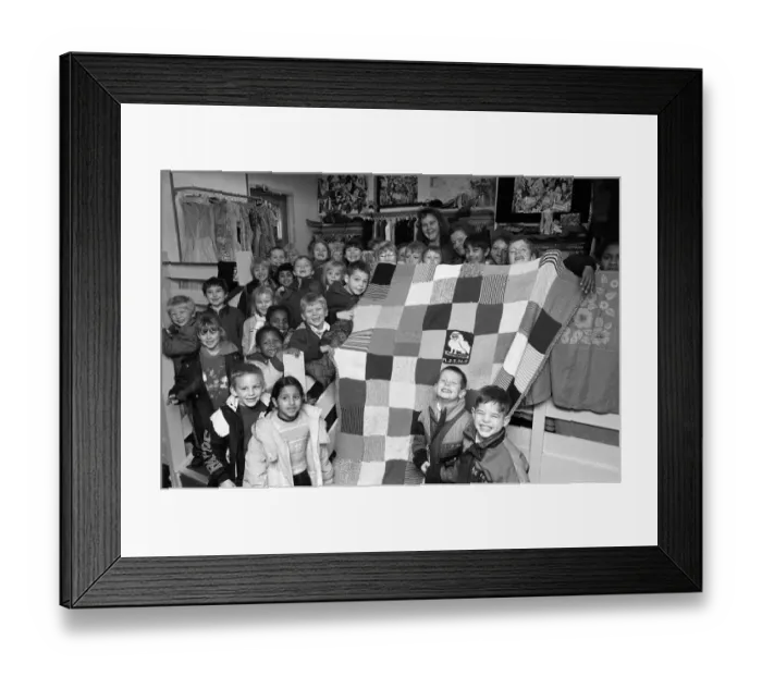 Framed Print : Moldgreen Junior and Infants School pulls with their knitted blanket Framed Print : Moldgreen Junior and Infants School pulls with their knitted blanket