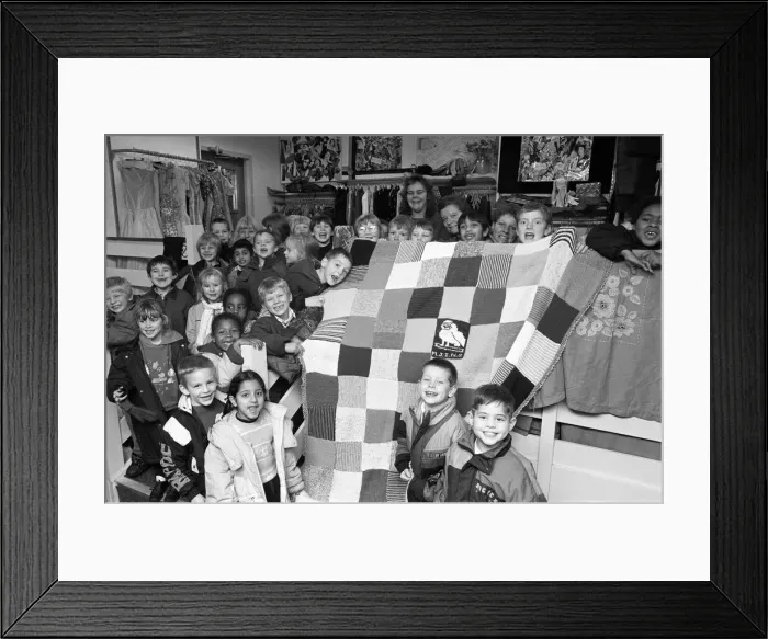 Framed Print : Moldgreen Junior and Infants School pulls with their knitted blanket