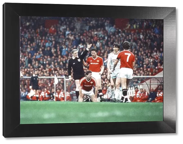 Left to right, Jesper Olsen, the referee, Brian McClair (on the floor)