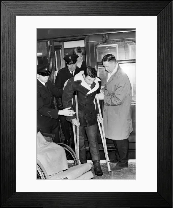 Framed Print : Charlton Athletic footballer Mike Bailey returns to London with his wife after breaking Framed Print : Charlton Athletic footballer Mike Bailey returns to London with his wife after breaking