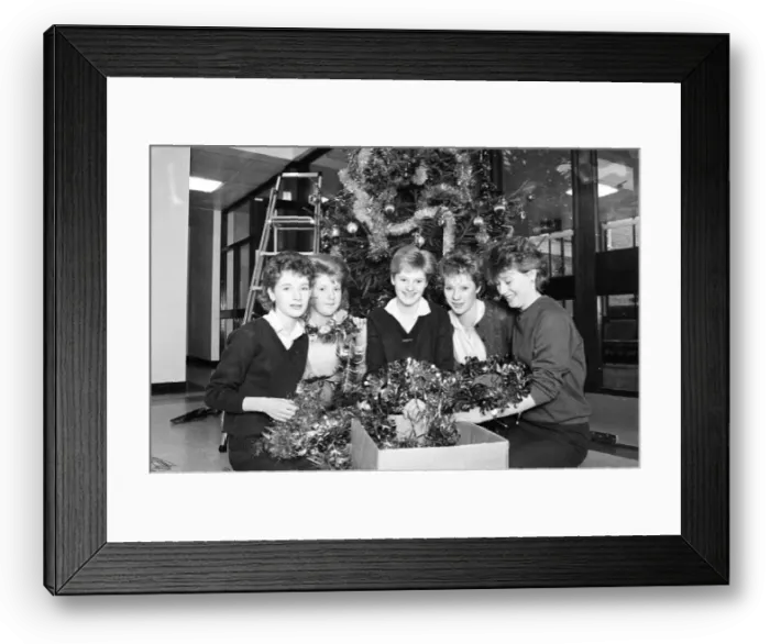 Framed Print : Rawthorpe High School pupils decorating the Christmas Tree in the entrance to St Luke Framed Print : Rawthorpe High School pupils decorating the Christmas Tree in the entrance to St Luke