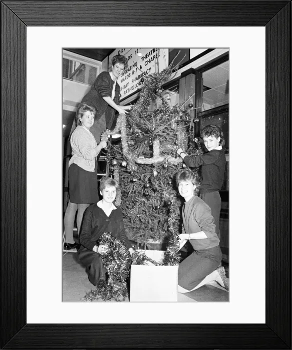 Framed Print : Rawthorpe High School pupils decorating the Christmas Tree in the entrance to St Luke Framed Print : Rawthorpe High School pupils decorating the Christmas Tree in the entrance to St Luke