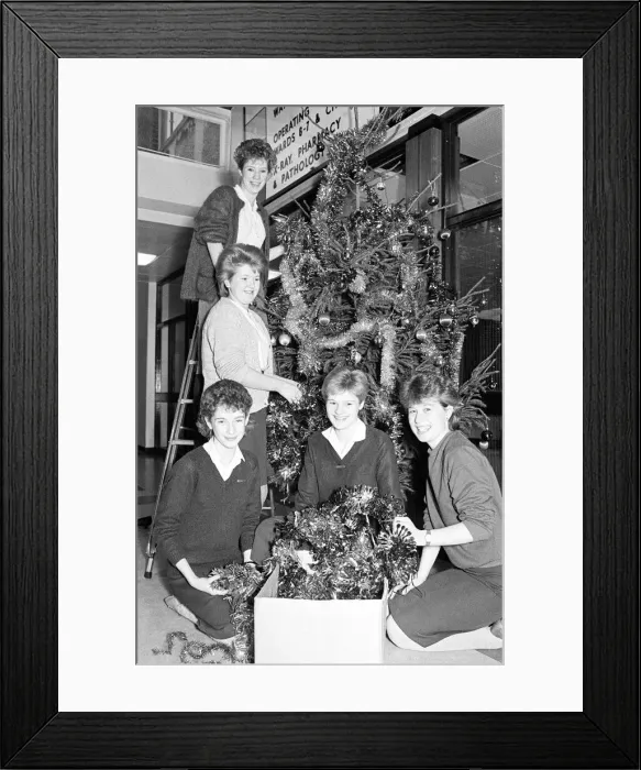 Framed Print : Rawthorpe High School pupils decorating the Christmas Tree in the entrance to St Luke Framed Print : Rawthorpe High School pupils decorating the Christmas Tree in the entrance to St Luke
