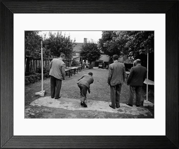Framed Print : A group of men enjoy a game of Bat and Trap at a pub in Kent