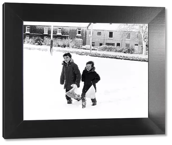 Christian Clapton (left) and Paul Isbel (right) trudge through the thick snow to get to