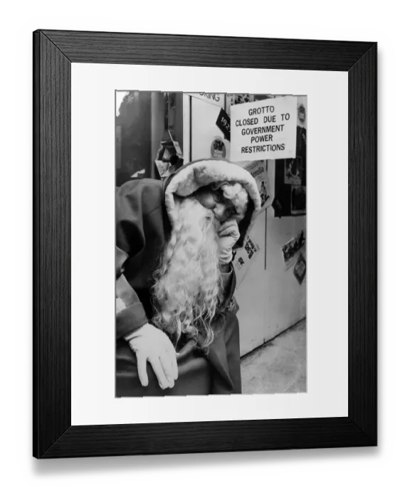Framed Print : A saddened Father Christmas at David Morgans store in Cardiff