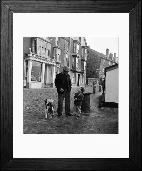 Framed Print : A fisherman and his son. Returning after a weeks absence on a fishing trip in the stormy Framed Print : A fisherman and his son. Returning after a weeks absence on a fishing trip in the stormy