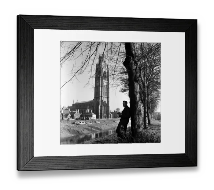 Framed Print : A man reading near St Botolphs Church in Boston, Lincolnshire. 2nd April 1953