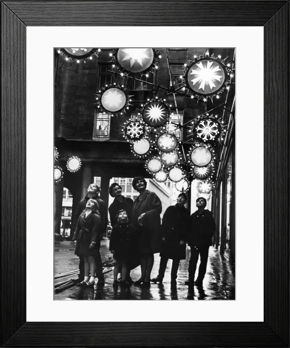 Framed Print : Shoppers enjoy a preview of the Christmas illuminations in the Minories outside Lewis Framed Print : Shoppers enjoy a preview of the Christmas illuminations in the Minories outside Lewis