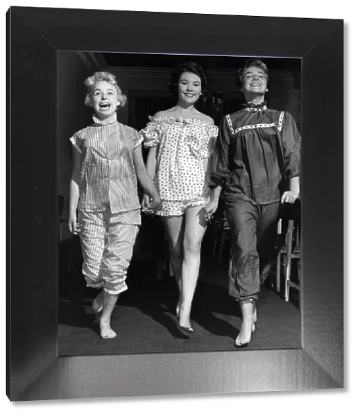A young Barbara Windsor (left) with two other female models in nightwear