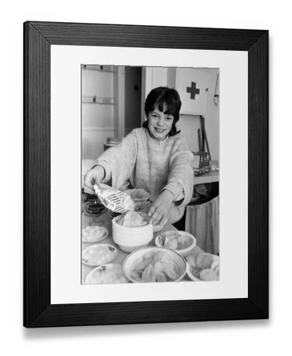 Framed Print : Victoria Gibson helps prepare for an annual tea party for some 80 pensioners at Parkwood Framed Print : Victoria Gibson helps prepare for an annual tea party for some 80 pensioners at Parkwood