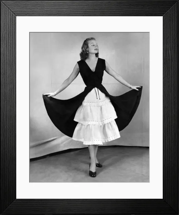 Framed Print : A model in a petticoat dress. December 1951 Framed Print : A model in a petticoat dress. December 1951