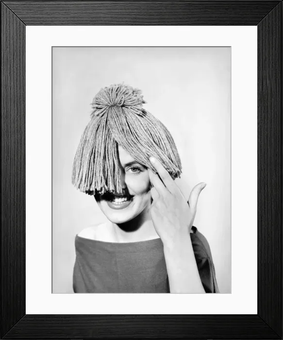 Framed Print : Woman wearing mop hat. 1955 Framed Print : Woman wearing mop hat. 1955