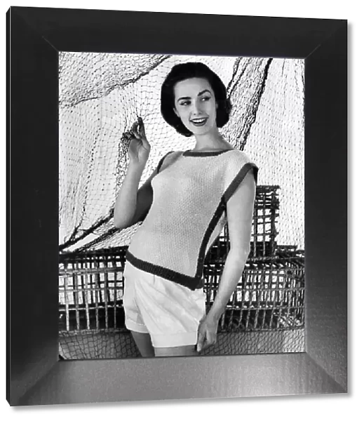 A woman modelling Knitwear. July 1956