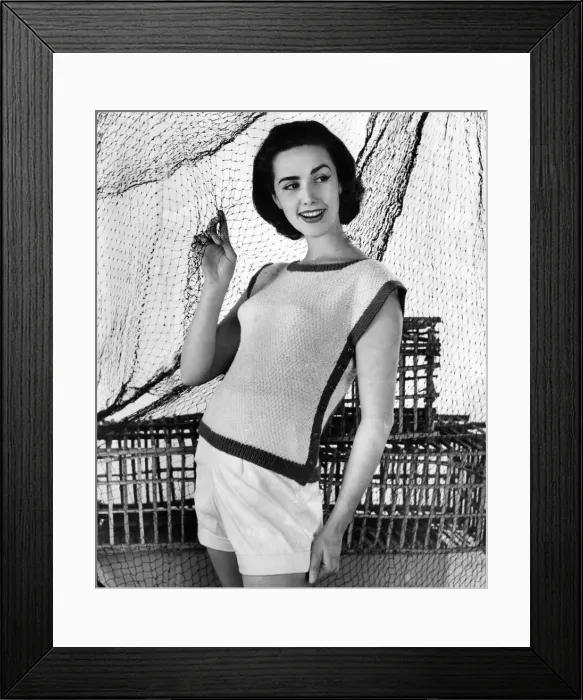 Framed Print : A woman modelling Knitwear. July 1956 Framed Print : A woman modelling Knitwear. July 1956