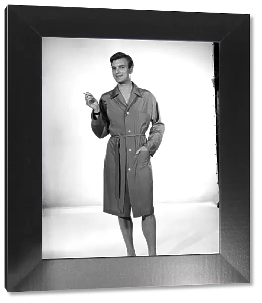 Model Jeremy Dempster wearing a sleeping coat. 1957