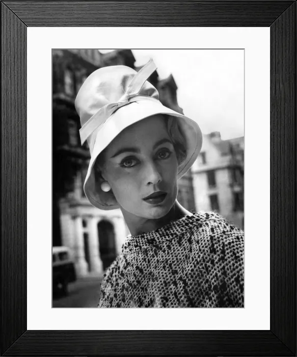 Framed Print : A woman modelling a fashionable hat. July 1957 Framed Print : A woman modelling a fashionable hat. July 1957