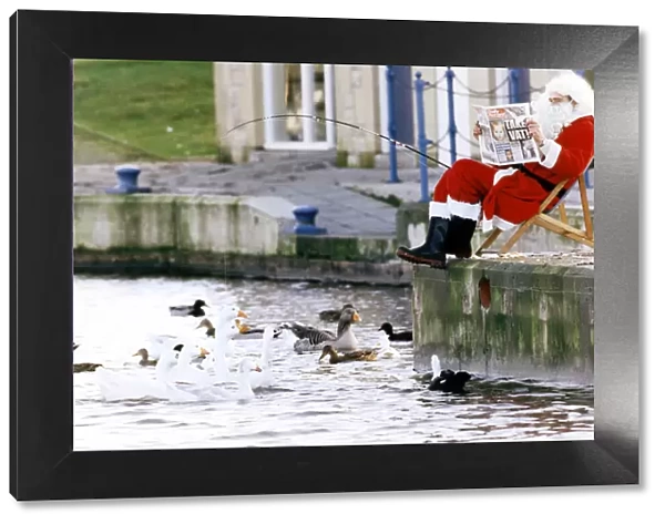 Father Christmas taking a break for the hustle and bustle of Christmas by going fishing